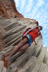Young girl in the desert. Beautiful landscape in the valley