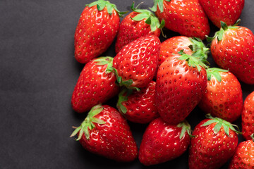 Closeup shot of fresh strawberries. on black background.