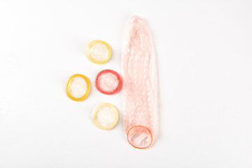 Flat lay colorful condoms isolated on white background