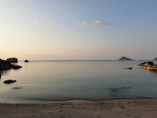 sunset in a lonely bay on koh tao island in thailand