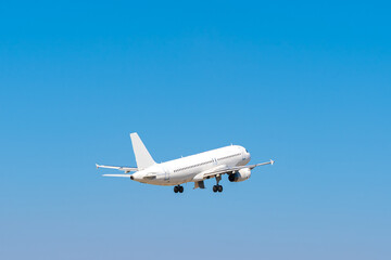 Passenger airplane flying against clear blue sky