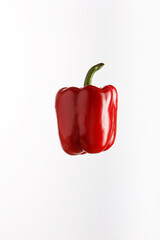Juicy red pepper on white background.