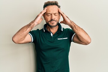 Fototapeta na wymiar Middle age man wearing casual clothes with hand on head, headache because stress. suffering migraine.