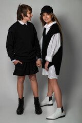 Children style and fashion. Beautiful kids teens in the studio. High quality photo.