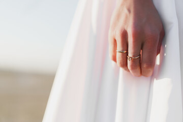 Hand of a bride with golden ring