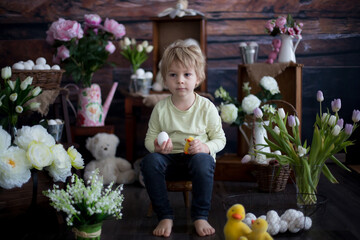Cute toddler blond child, boy with easter decoration