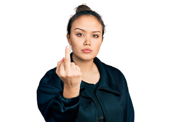 Young hispanic girl wearing sportswear showing middle finger, impolite and rude fuck off expression
