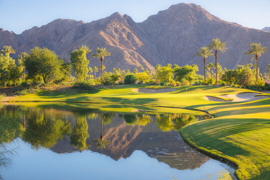 Beautiful Golden Light Over Indian Wells Golf Resort, A Desert Golf Course In Palm Springs, California, USA With View Of The San Bernardino Mountains.