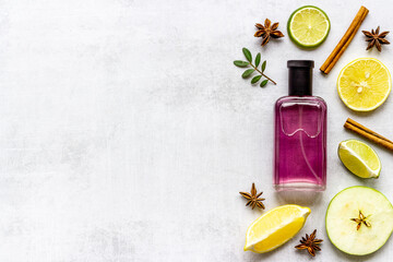 Men perfume bottle with fruits and flowers, top view