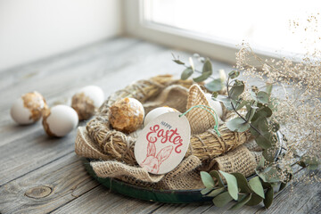 Easter composition with festive eggs in a decorative nest.