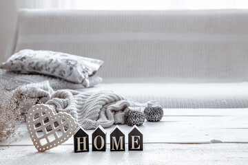 Cozy composition in Scandinavian style with decorative word home and decor details copy space.