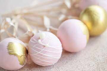 The pastry chef decorates cake pops with satin ribbons.Various cake pops decorated with white and dark chocolate on a brown background. High quality photo.