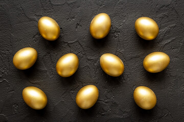 Golden eggs flat lay. Save money. Wealth and good luck symbol