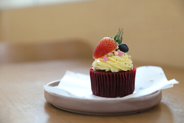 Colorful cupcakes on wood table background