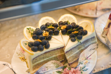 Cake on shelf with cake blueberry and lemon on store bakery shop