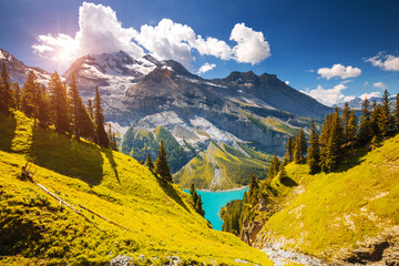 Spectacular view of the lake Oeschinensee in sunny day. Location place Swiss alps, Kandersteg...