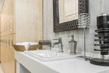 Close-up of a washbasin with a faucet in the bathroom