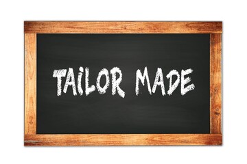 TAILOR  MADE text written on wooden frame school blackboard.