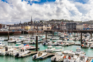 Fecamp, Normandy, France - August 28, 2020. Beautiful panoramic view on main harbor with yachts, fish sailing boats. Albaster coast.