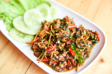 frog meat chopped puff hot and spicy with herb spices on plate food - Stir fried frog and chilli red curry