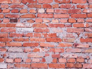 red brick wall with very low quality masonry