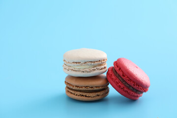 Colorful macarons isolated in blue background