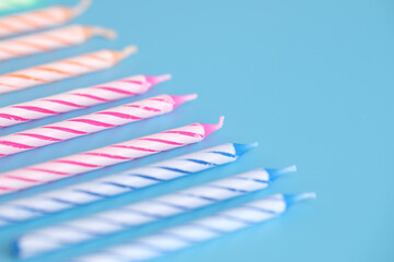 Colorful candles isolated in blue background
