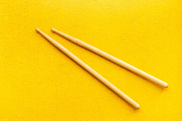 Two wooden drum sticks, top view. Music background