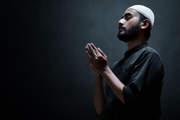 Religious asian muslim man praying