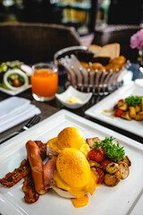 Eggs Benedict toasted English muffins. Delicious breakfast with eggs Benedict