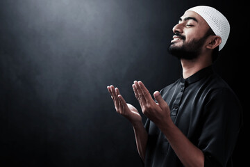 Religious asian muslim man praying