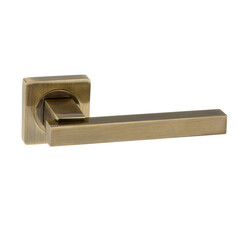 Bronze door handle on a square base with a square handle with a glossy finish in a simple modern classic design on a white background