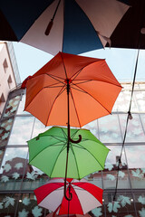 decorative colored umbrellas hanging on the wires