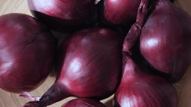 Full Frame Shot Of Purple Onions. Fresh whole onions. Rotation