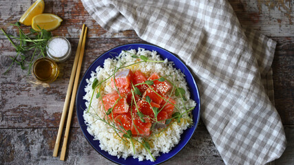Selective focus. Rice with salmon and microgreens. Healthy food. Poke bowl.