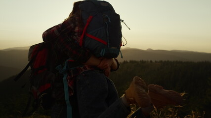 Man holding woman on hands in mountains. Guy spinning girl on hands around