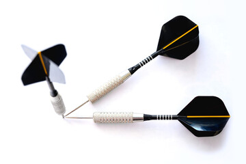 Three darts pointing the same target on an isolated white background. Straight to the aim of...