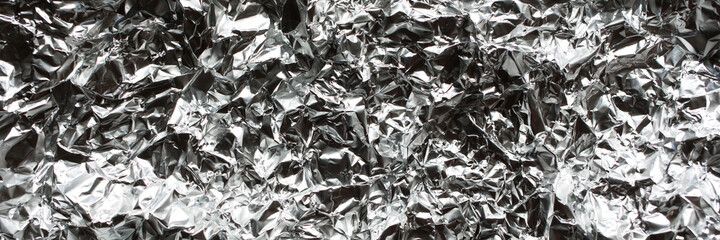 empty crumpled silver foil. abstract texture background