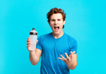 sport boy looking angry, annoyed and frustrated screaming wtf or what’s wrong with you. energy...
