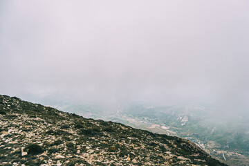 Fototapeta premium cloudy day with fog in the mountains of the natural park of the ports, in tarragona (spain)
