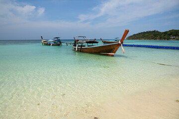 Scene of Pattaya beach and longtail boats at Lipe island
