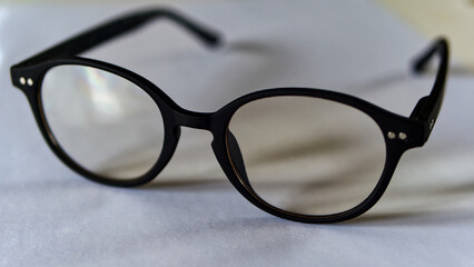 Fototapeta na wymiar Eyeglasses, not new, black rimmed, clear glasses
