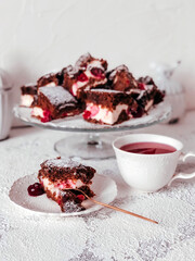 Homemade Brownie pie with cream cheese and cherries.