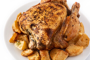 Homemade roasted chicken with potatoes isolated on white background. 