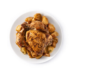 Homemade roasted chicken with potatoes isolated on white background. Top view. Copy space