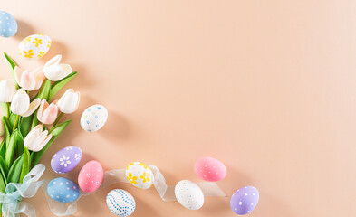 Fototapeta na wymiar Happy easter! Colourful of Easter eggs with flower on pastel background. Greetings and presents for Easter Day celebrate time. Flat lay ,top view.
