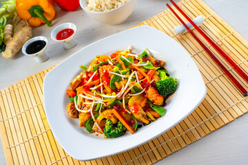 sweet and sour chicken with rice and vegetables