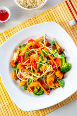 sweet and sour chicken with rice and vegetables