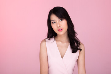 Fashion Beauty Woman has long black hair, pink Tone portrait