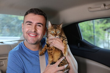 Handsome man traveling with his cat